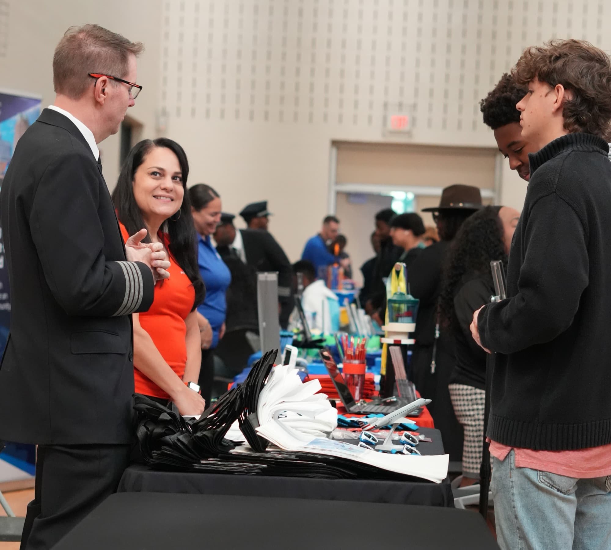 Airline professionals with students