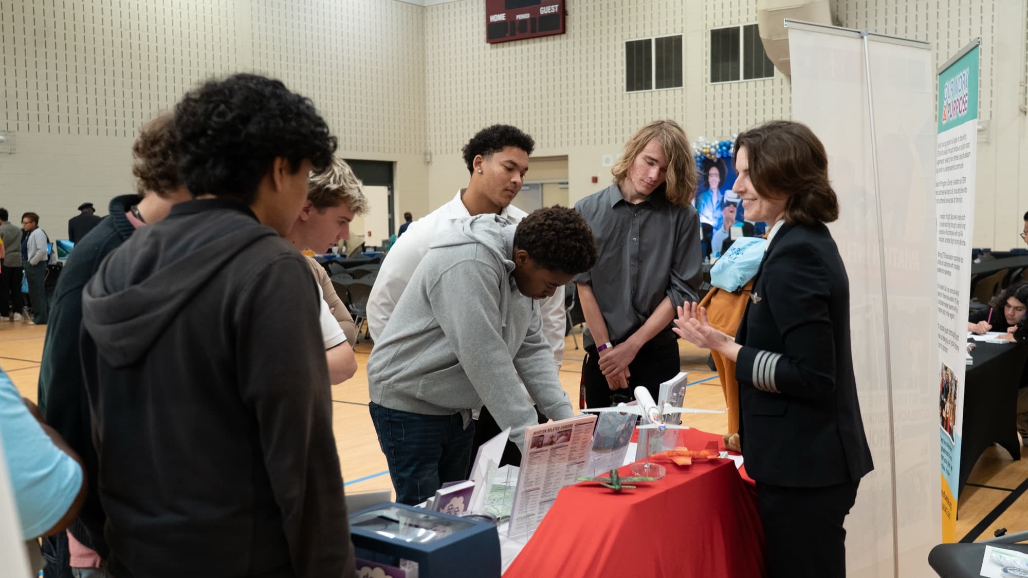 Pilot discussing careers with students